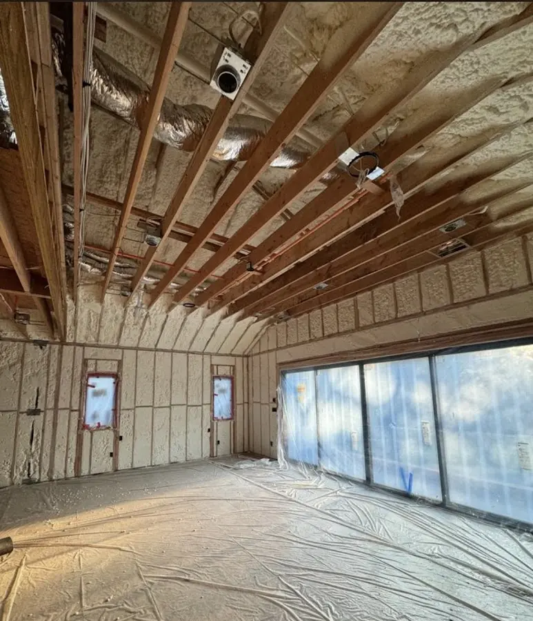 Interior walls and ceiling insulated with spray foam during new construction in Cumberland